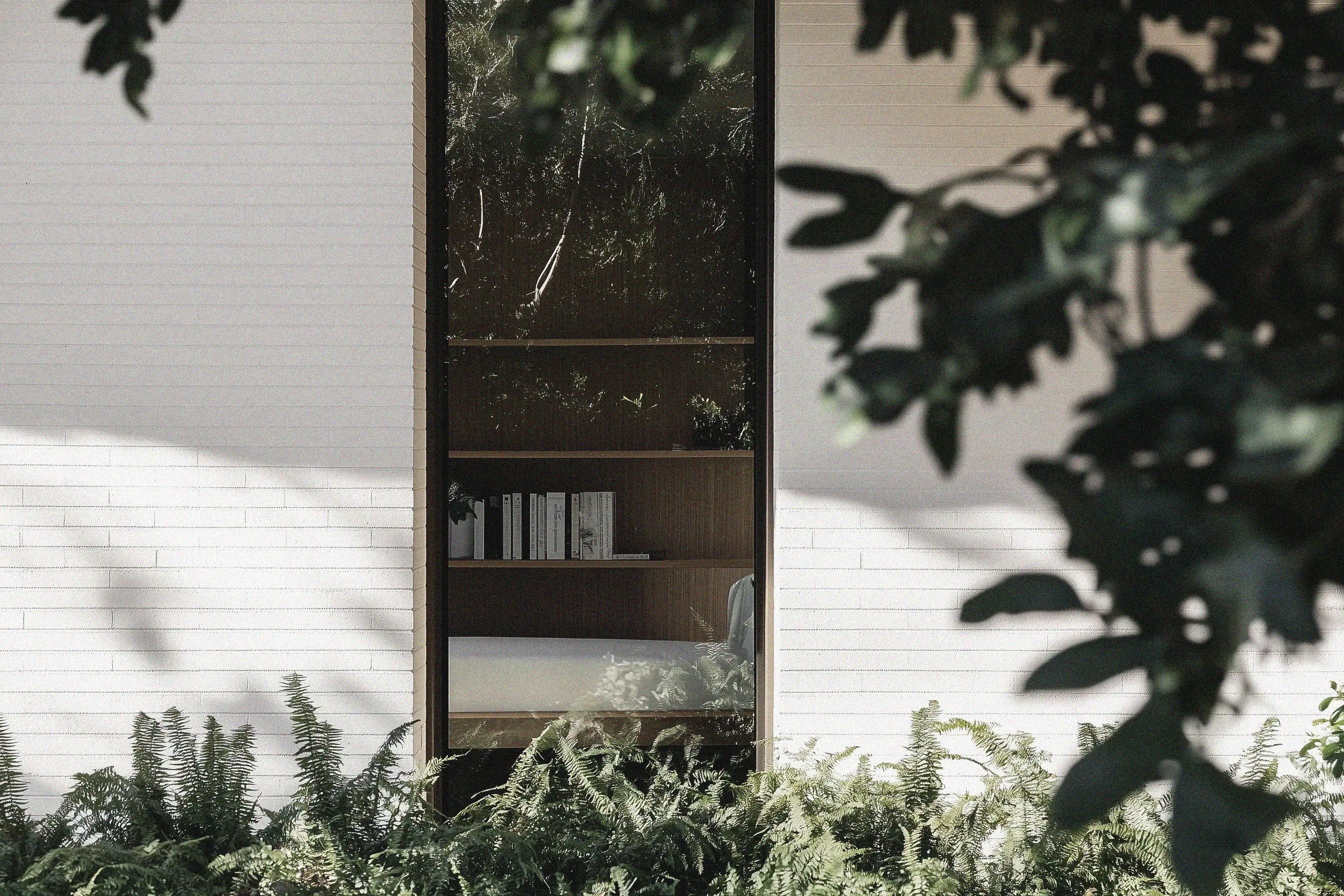 Brighton Brick House detail - shade-tolerant plants and dense garden beds